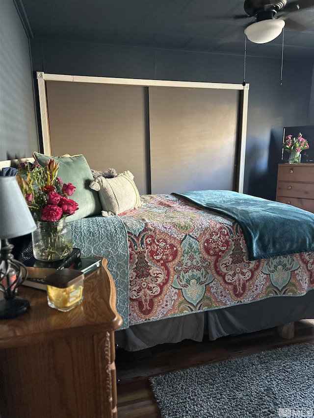 bedroom featuring hardwood / wood-style flooring and ceiling fan