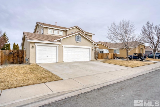 front facade featuring a front lawn and a garage