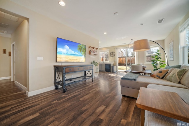 living room with dark hardwood / wood-style floors