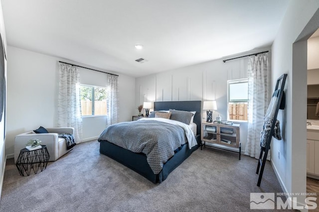 carpeted bedroom with visible vents