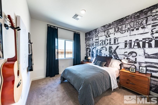 carpeted bedroom featuring visible vents and baseboards