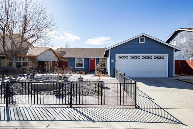 view of front of property featuring a garage, concrete driveway, and fence