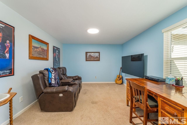 office featuring baseboards and light colored carpet