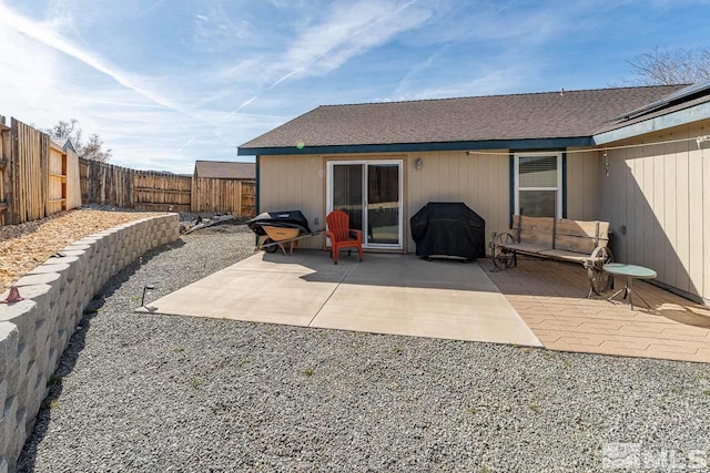 view of patio / terrace with a fenced backyard and a grill