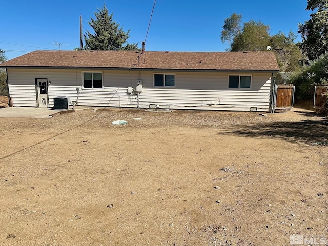 rear view of property with a patio area, fence, and cooling unit