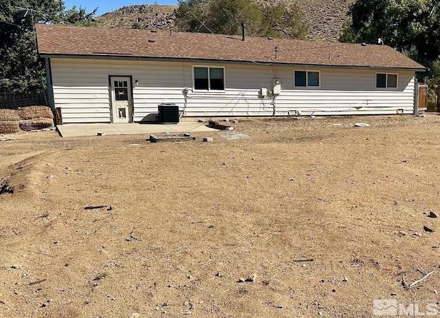 back of house featuring central air condition unit and a patio