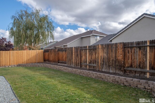 view of yard with a fenced backyard