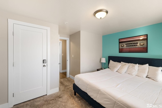 carpeted bedroom with baseboards