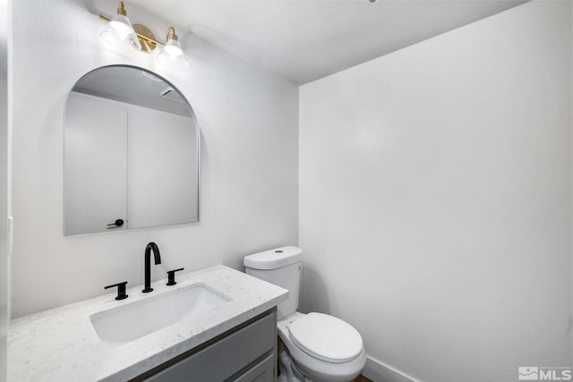 half bath with toilet and vanity