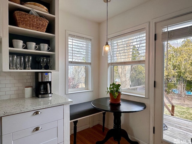 dining space featuring wood finished floors