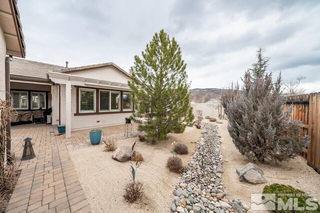 view of yard with a patio area and fence