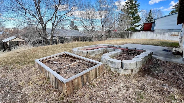 view of yard with a vegetable garden and fence