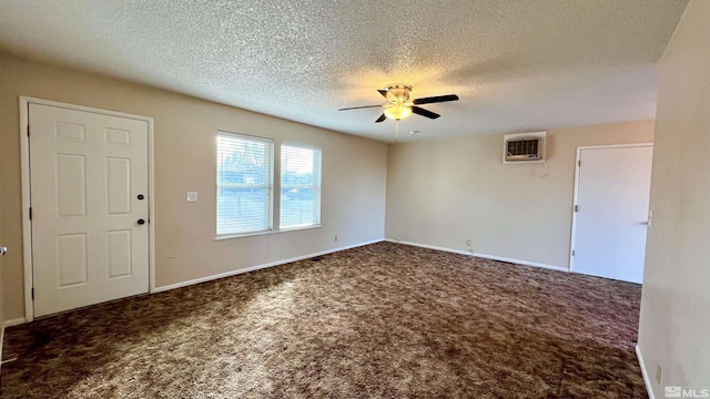 interior space with carpet floors, a textured ceiling, baseboards, and a ceiling fan