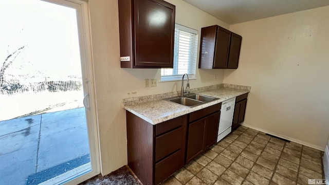 kitchen with a sink, baseboards, light countertops, dark brown cabinets, and dishwasher