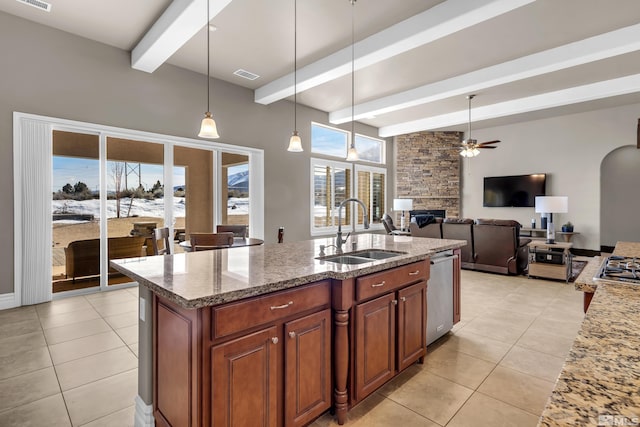 kitchen with light stone counters, beam ceiling, visible vents, a sink, and dishwasher