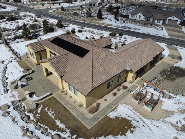 snowy aerial view featuring a residential view