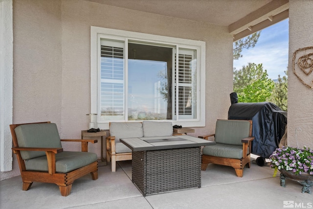 view of patio with a grill and outdoor lounge area