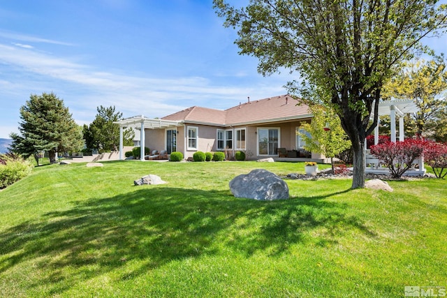 rear view of property featuring a lawn, stucco siding, a tile roof, and a pergola