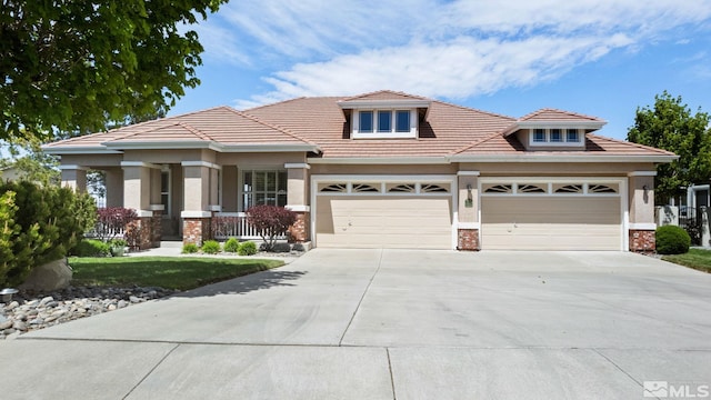 view of front of home with driveway, a tiled roof, an attached garage, a porch, and brick siding