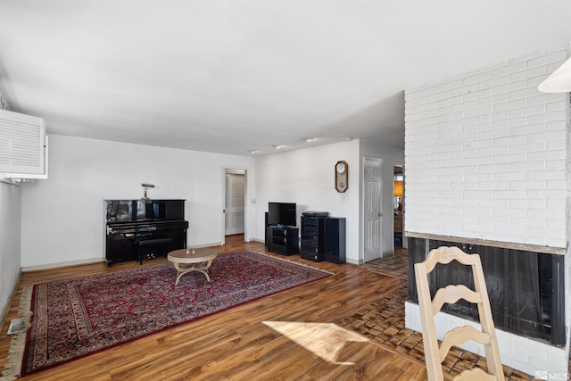 living room featuring dark wood finished floors and baseboards