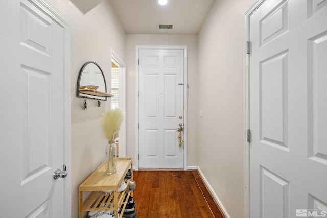 entryway featuring dark wood finished floors, visible vents, and baseboards