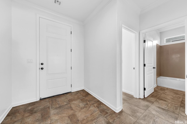 interior space featuring ornamental molding, visible vents, and baseboards