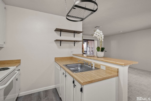 kitchen with white appliances, a sink, white cabinetry, light countertops, and open shelves