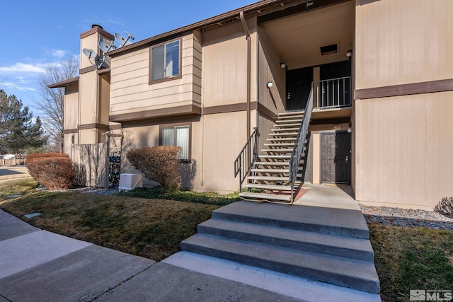 view of property featuring stairway