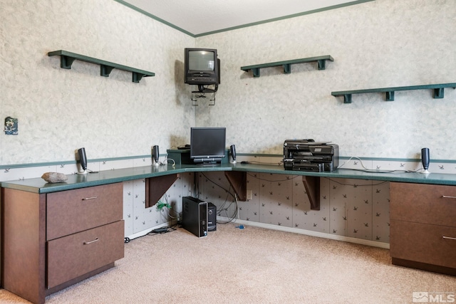 office with wallpapered walls, crown molding, and light colored carpet