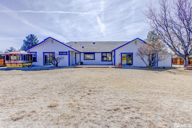 view of front of house with fence