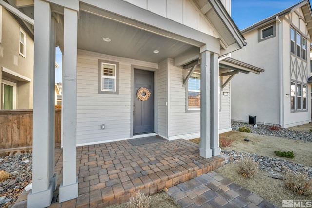 doorway to property with board and batten siding