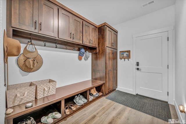 mudroom featuring wood finished floors and visible vents