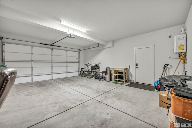 garage with water heater and a garage door opener