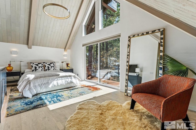 bedroom featuring access to outside, high vaulted ceiling, light wood-style flooring, and beamed ceiling