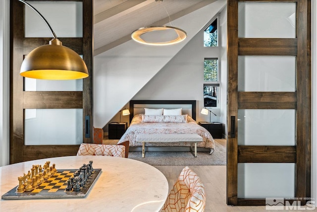 bedroom featuring lofted ceiling