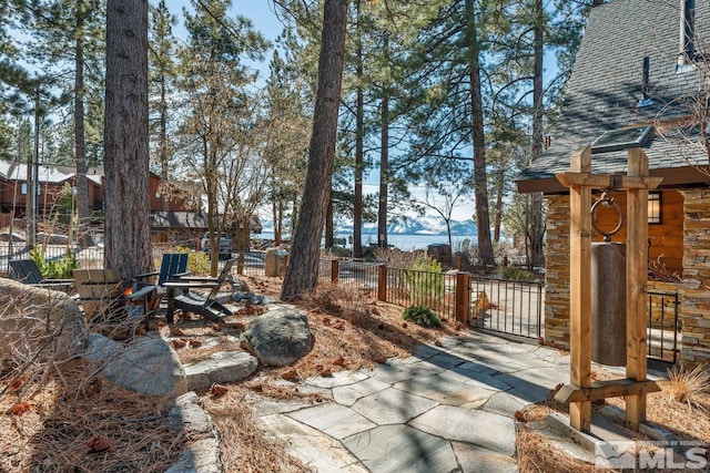 view of yard featuring a mountain view and fence