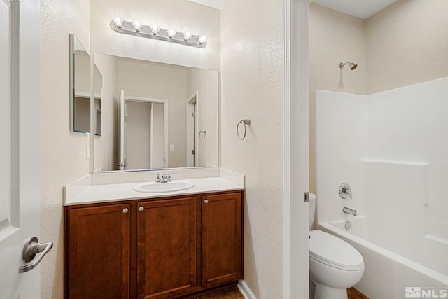 full bath featuring washtub / shower combination, vanity, and toilet