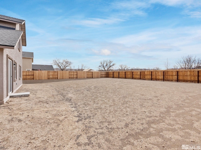 view of yard with a fenced backyard