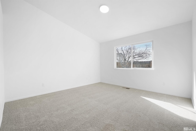 spare room with carpet and visible vents