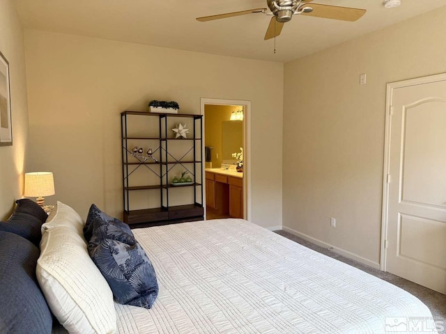 bedroom featuring a ceiling fan, carpet flooring, baseboards, and ensuite bathroom