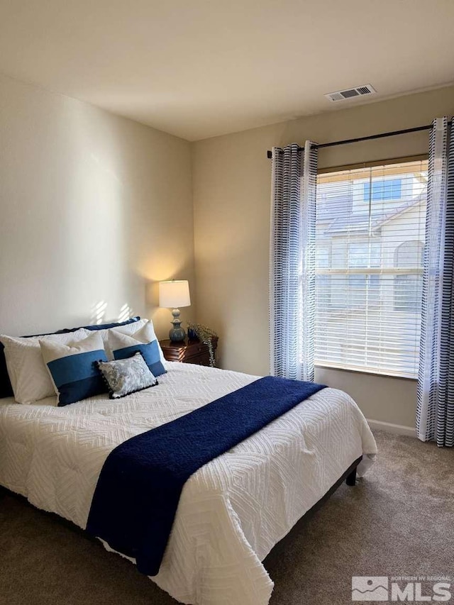 carpeted bedroom with visible vents