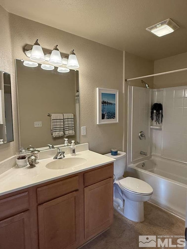 bathroom featuring toilet, a textured wall, a textured ceiling, and visible vents