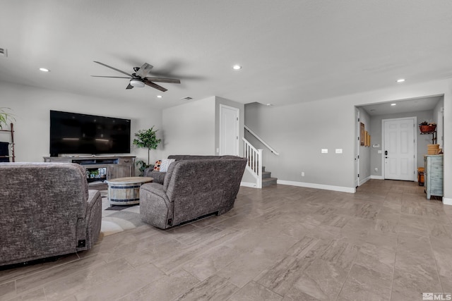 living area featuring recessed lighting, visible vents, a ceiling fan, baseboards, and stairs