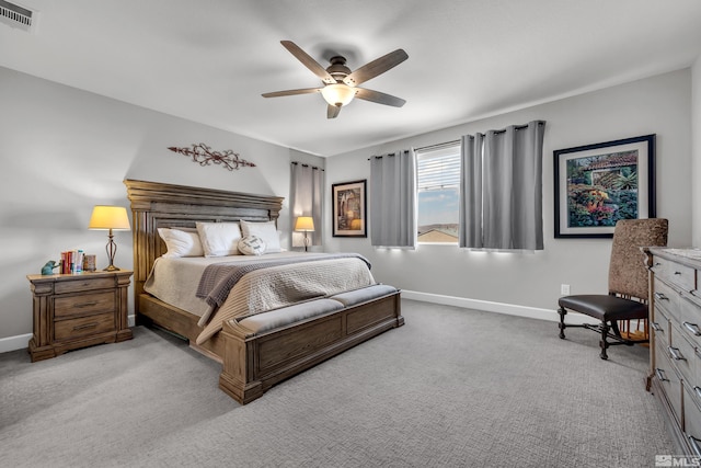 bedroom featuring light carpet, baseboards, visible vents, and a ceiling fan