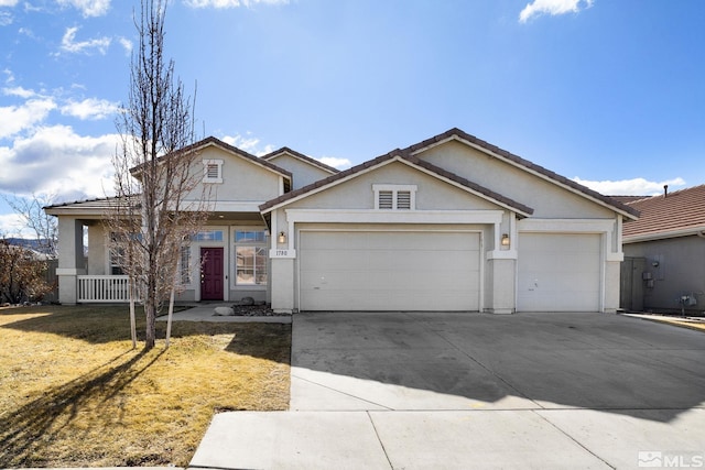 ranch-style home with driveway, an attached garage, and stucco siding