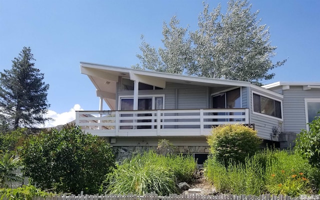 back of house with fence