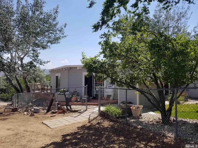 rear view of property featuring fence