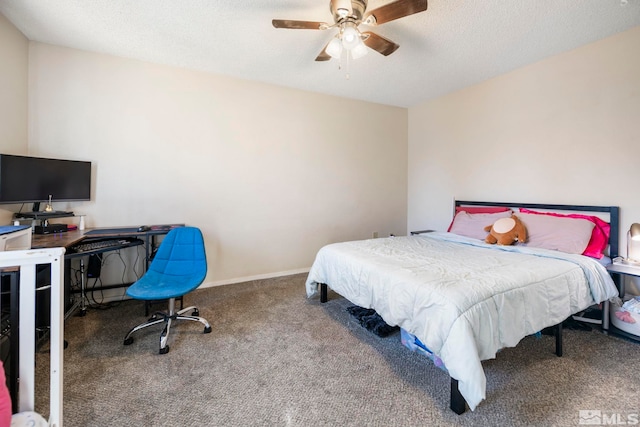 carpeted bedroom featuring ceiling fan, a textured ceiling, and baseboards