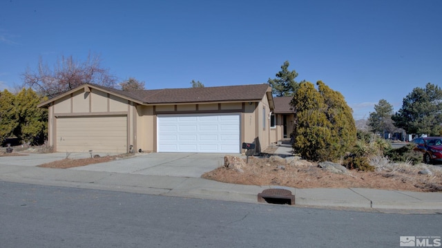 view of front of home featuring a garage and concrete driveway