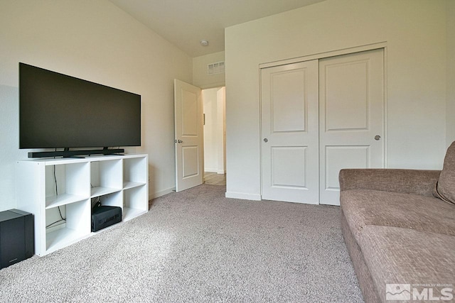 unfurnished living room featuring carpet flooring and visible vents